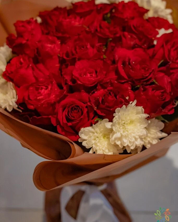 Red Roses with white flowers